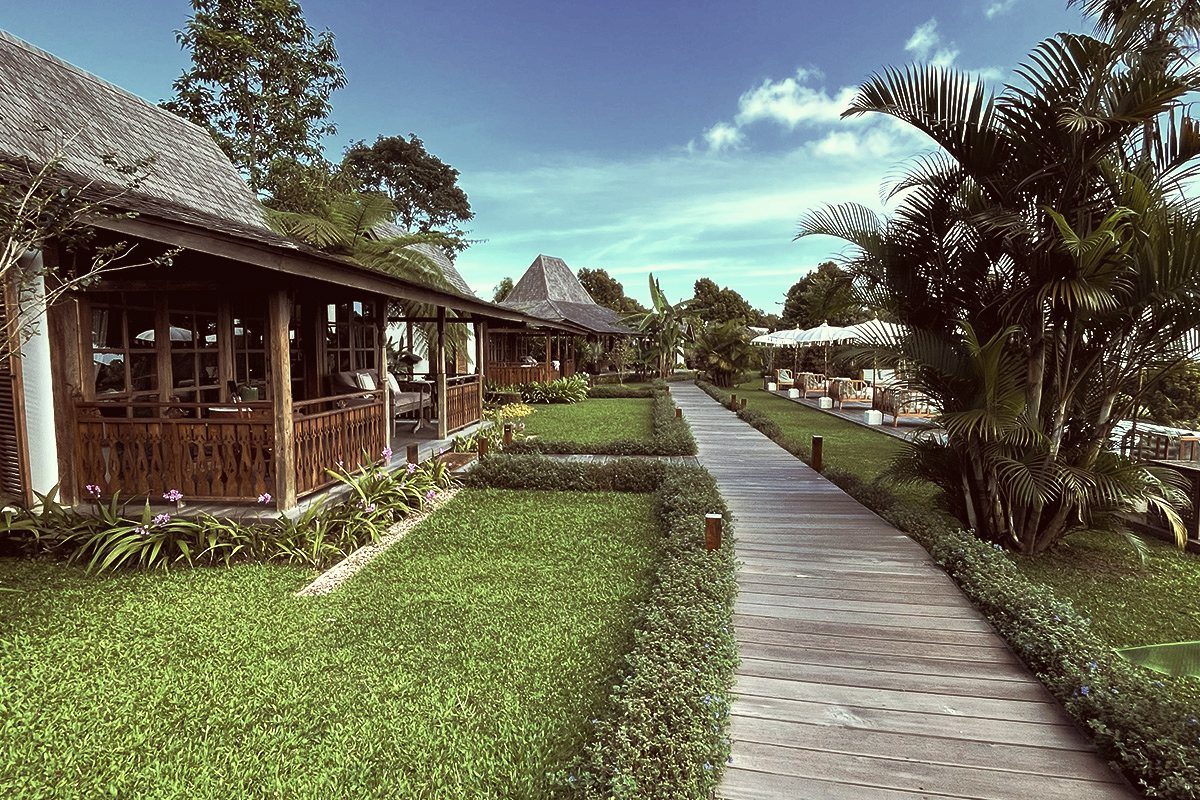 Timber pavilions and garden path at a curated stay in the C.U.D. Collection