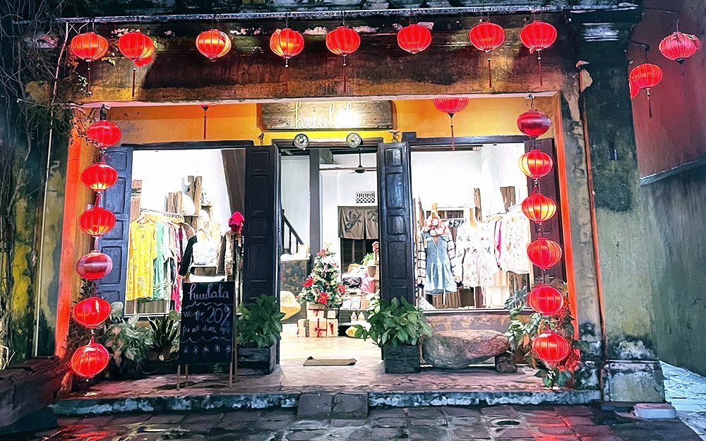 Red silk lanterns lighting a shopfront in the old town of Hoi An, Vietnam